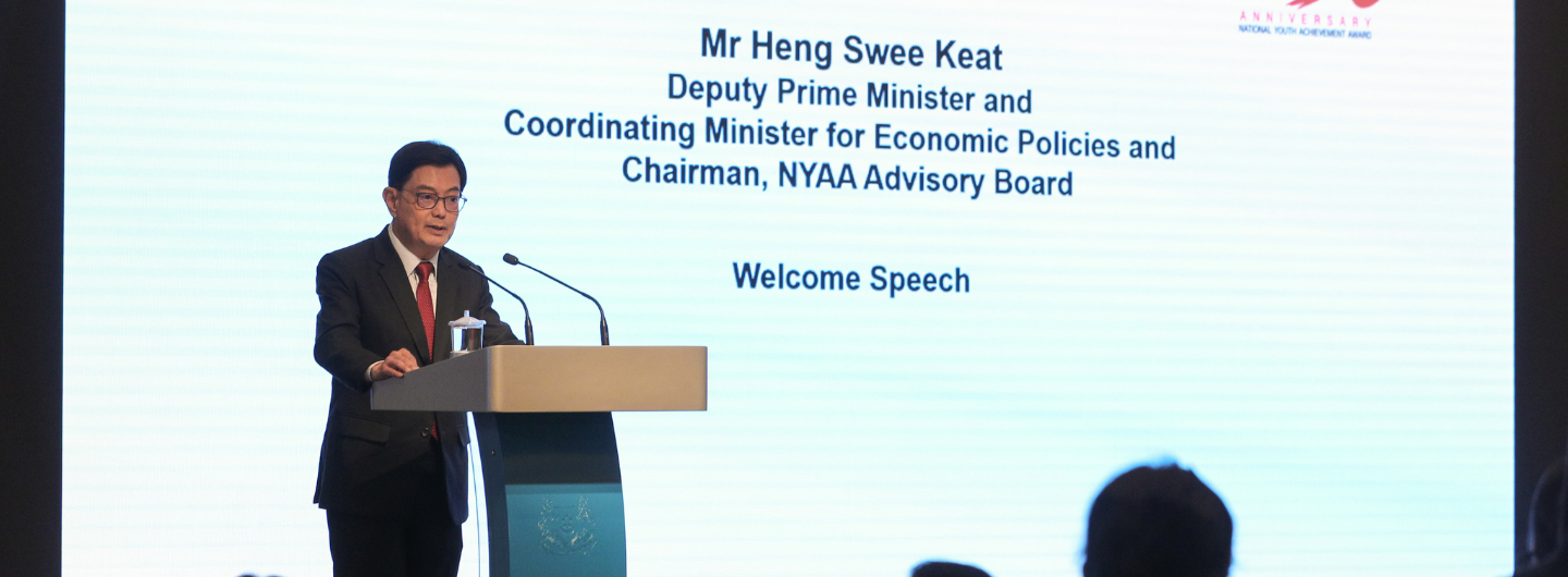 Mr. Heng Swee Keat at podium giving a "Welcome Speech," NYAA logo visible.
